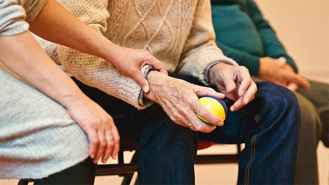 Elderly man and carer